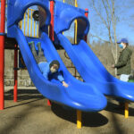 boy comes down on slide